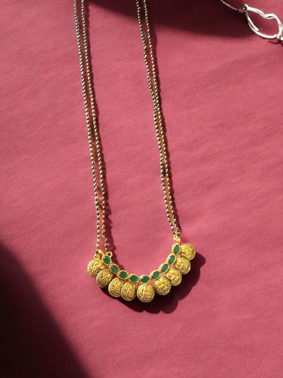 Black beads chain with kasulu with green stones pendent with gold polish