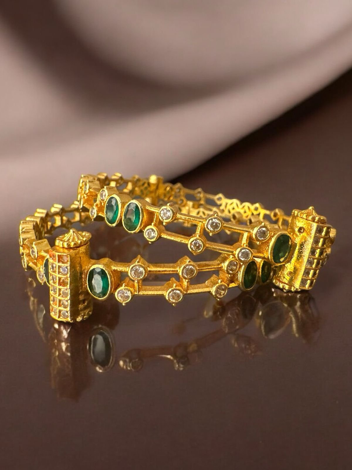 Cz green stones screw modal bangles with gold polish