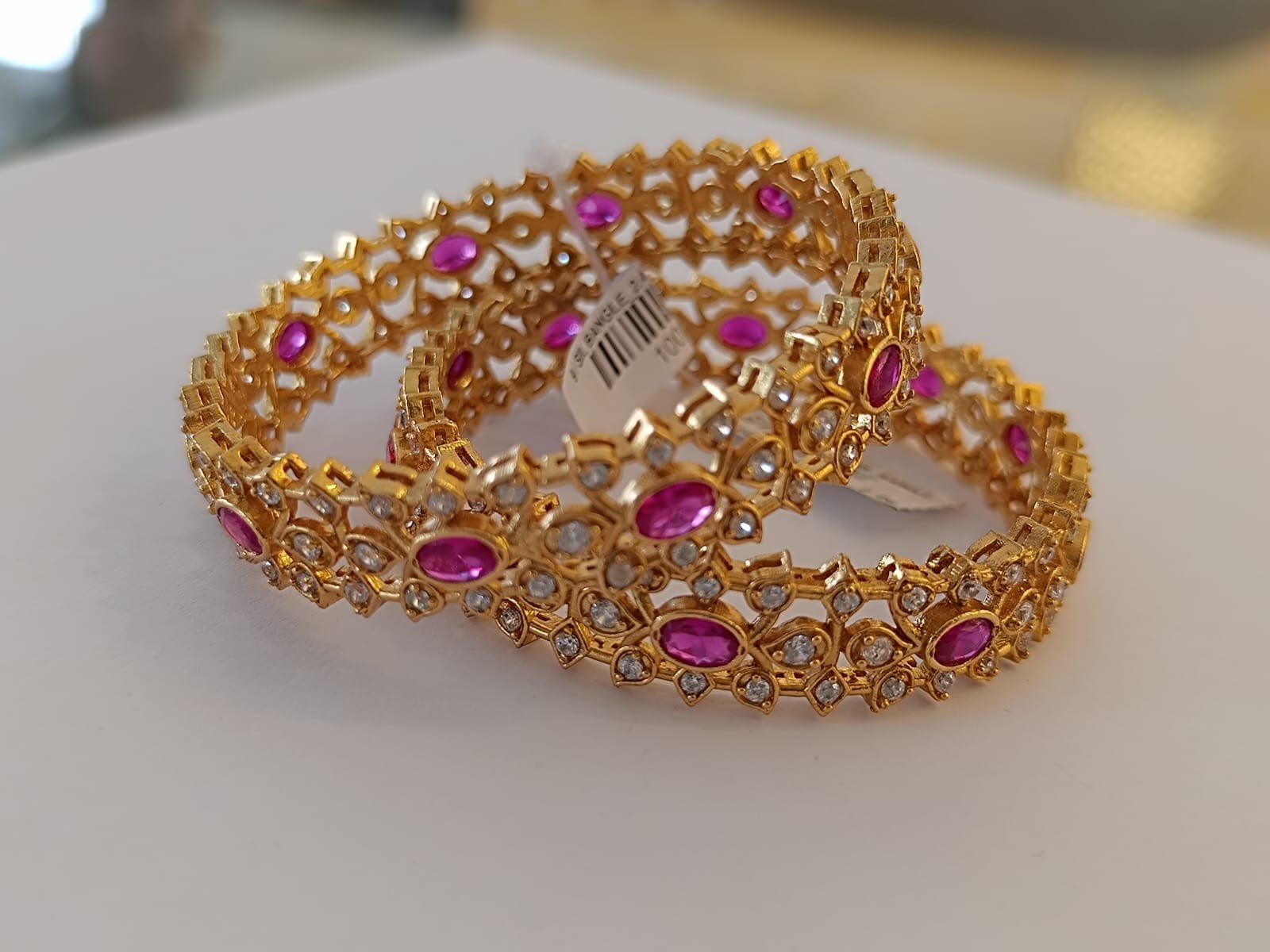 Cz stones white stones and ruby stones with gold polish bangle