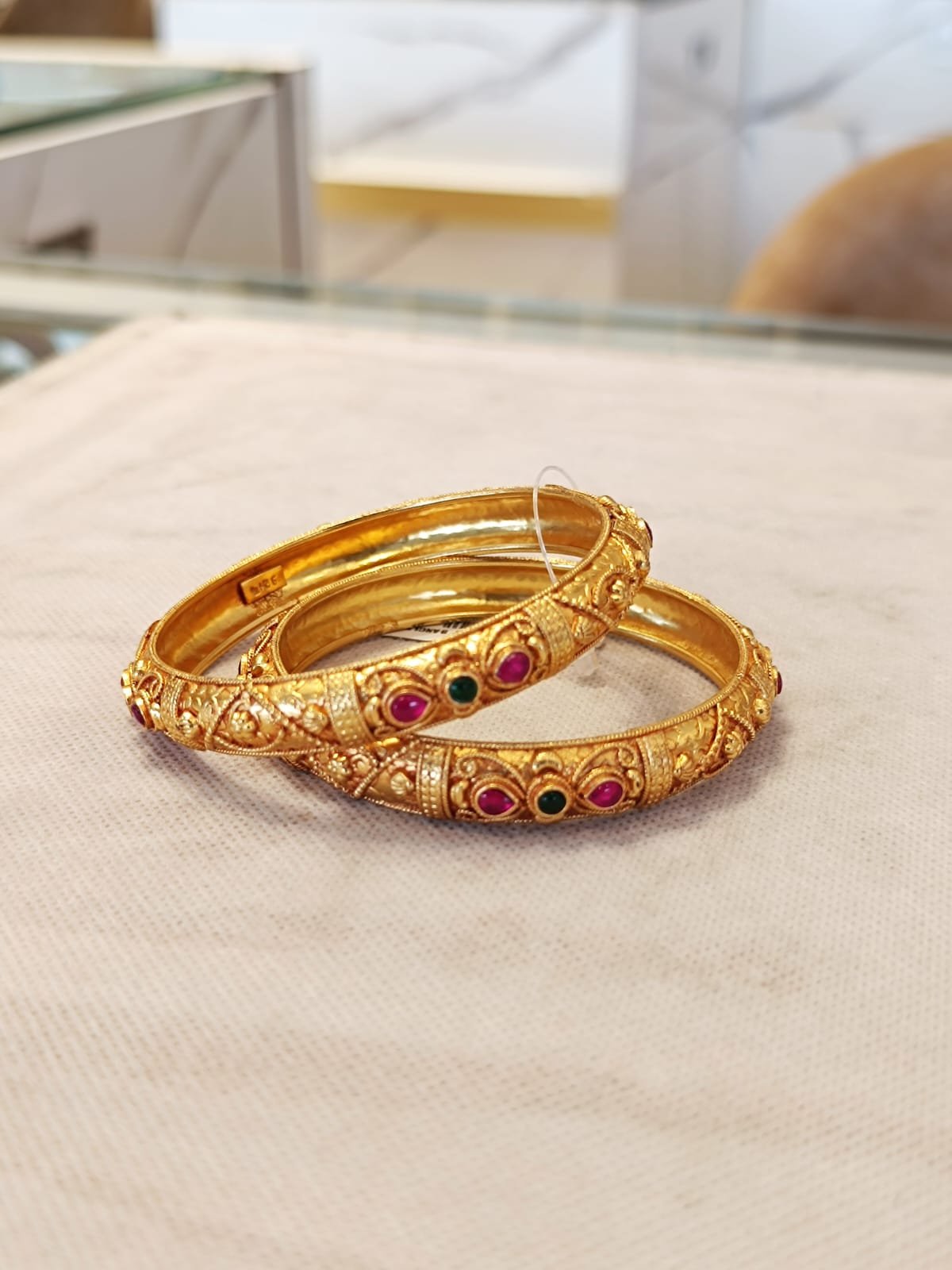 Gold polish and ruby stone bangle