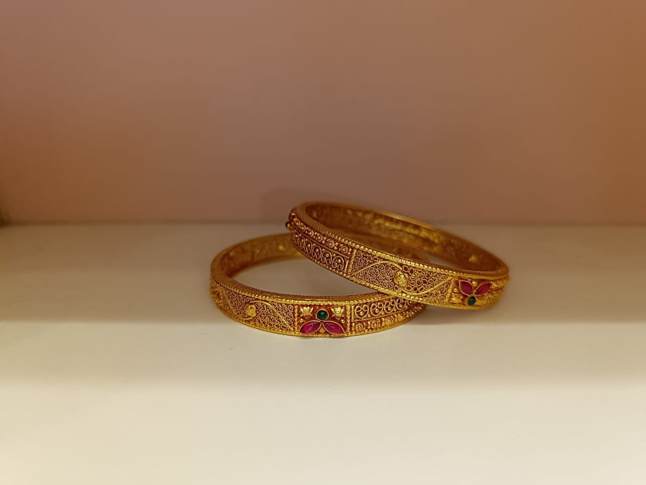Gold polish red and green stones bangle