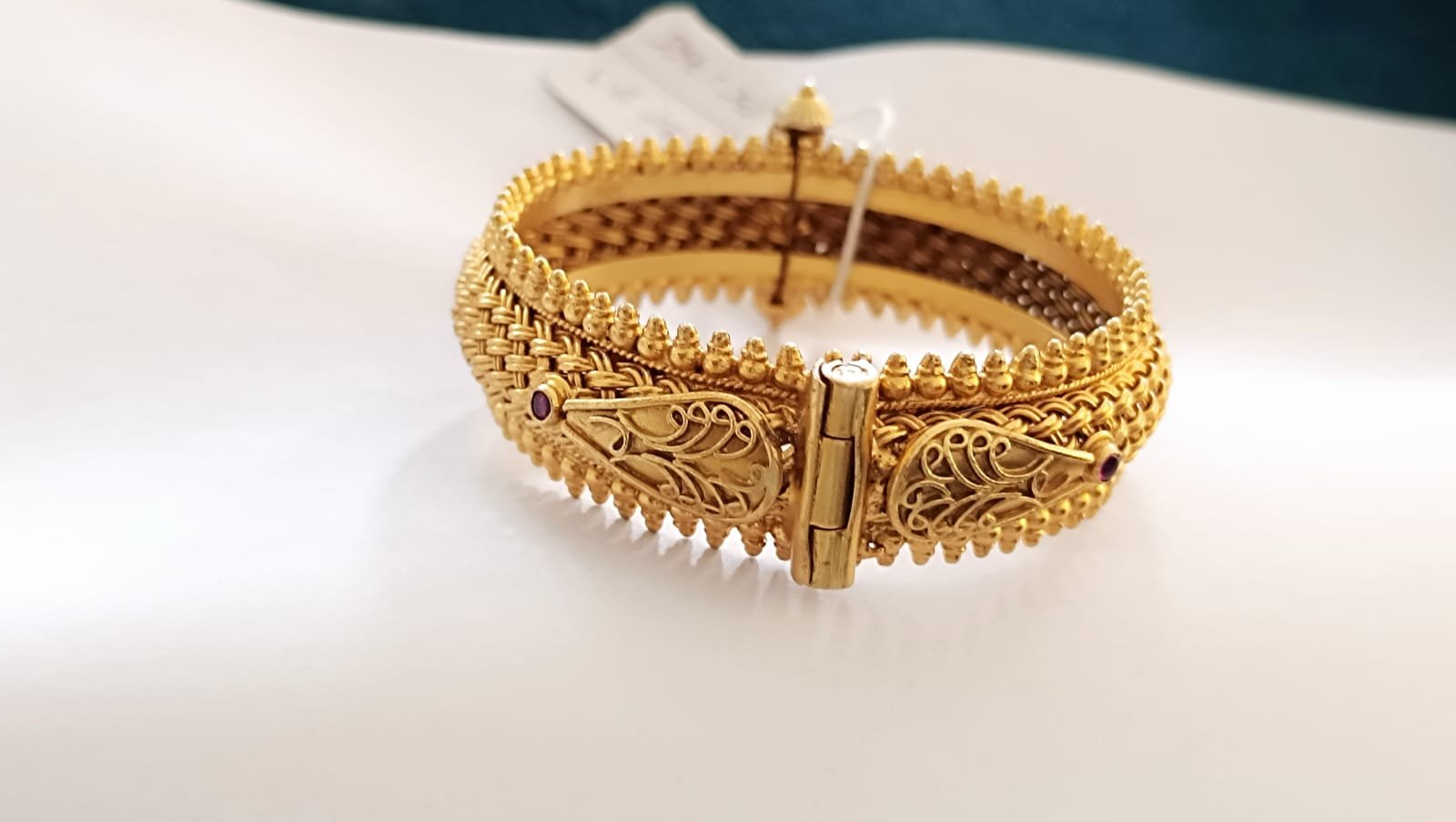 Gold polish scrow modal bangle