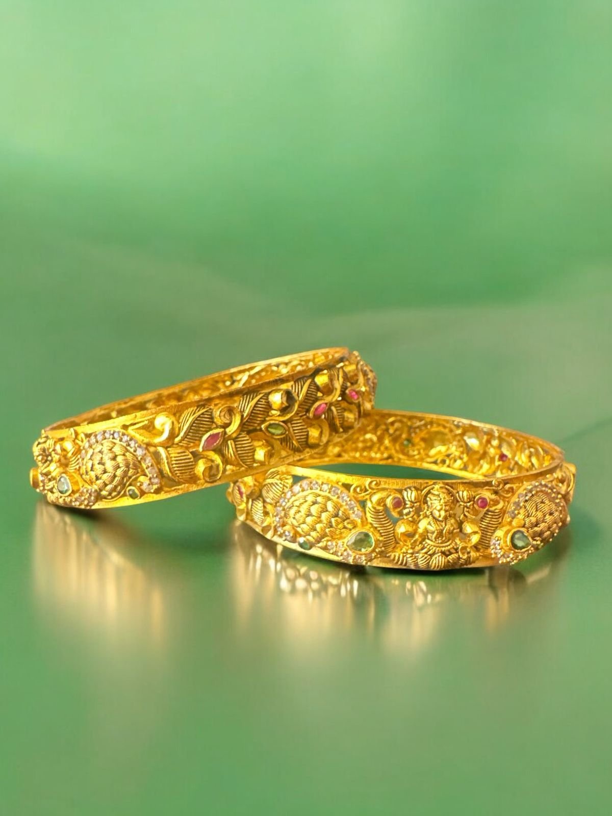 Lakshmi design and peacock modal with gold polish green and red stones