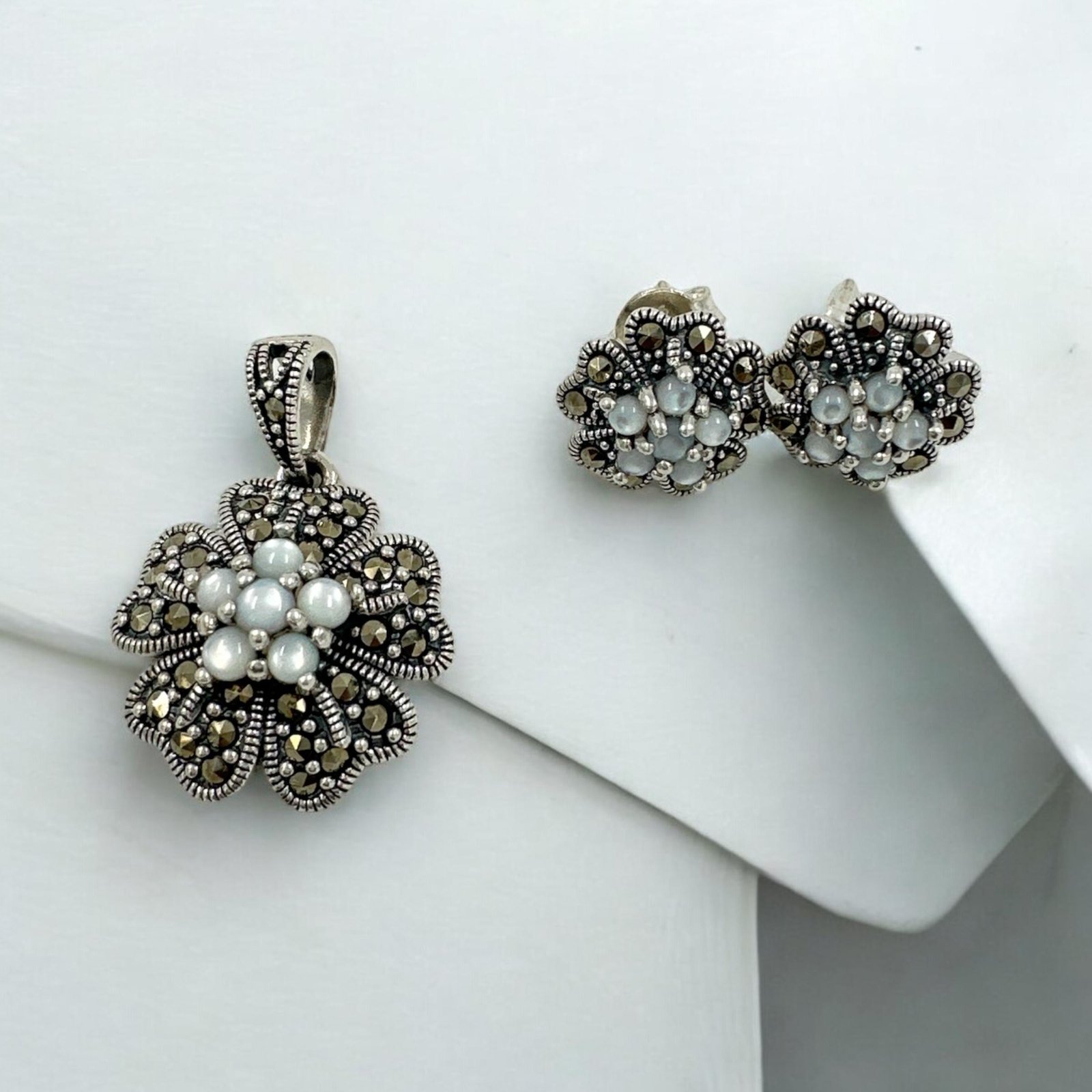 Marker stones with silver polish and white stones  pendent set