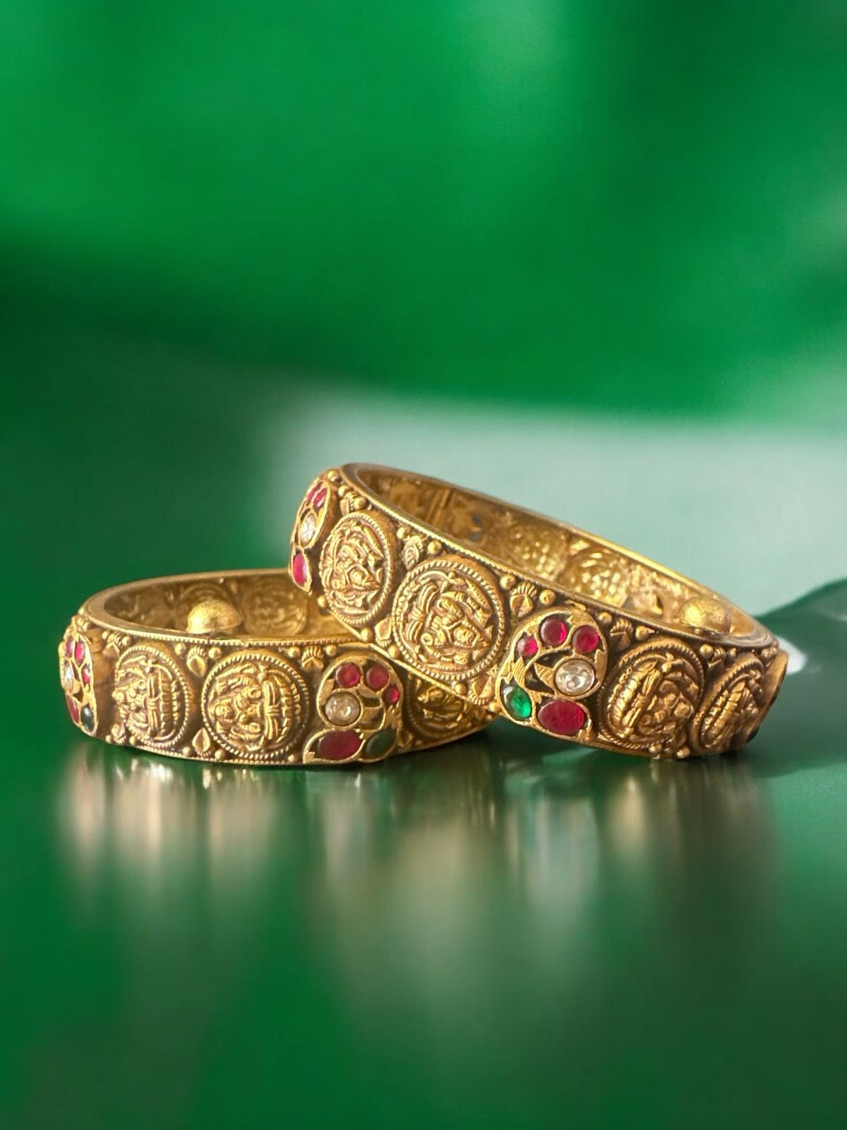 Nakshi design and tri color  stones with gold polish bangle