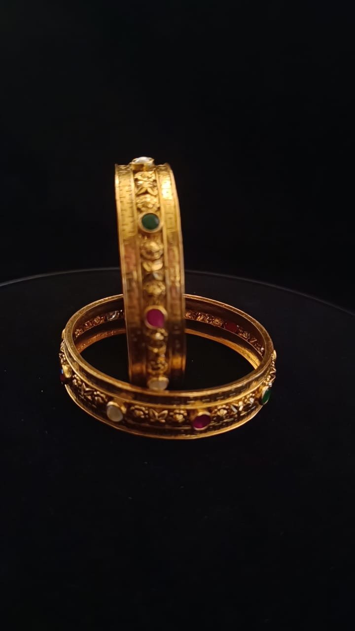 Navarathna stones with gold polish brode bangles