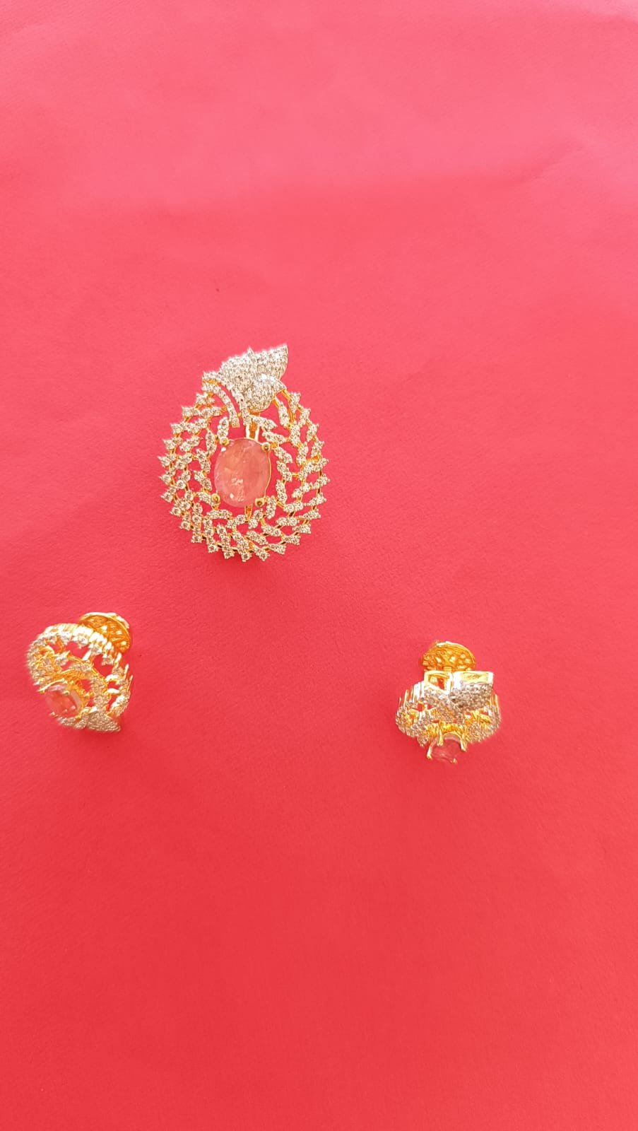 Premium cz stones with gold polish  and lite pink stones pendent set