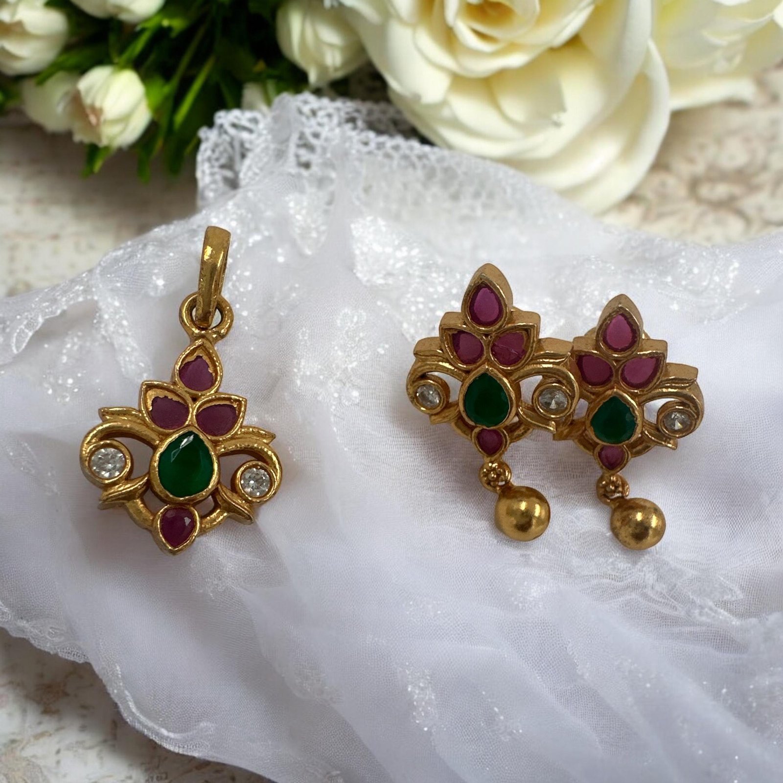 Ruby and green and white Kundan stones with gold polish pendent set