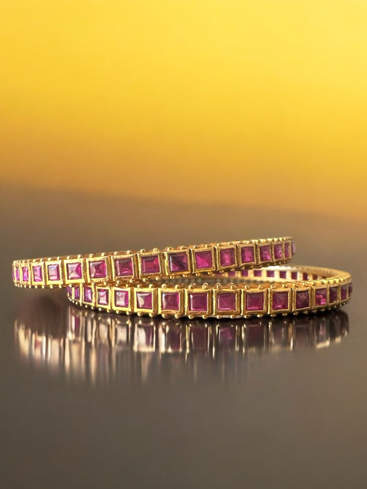 Ruby stone bangle with gold polish