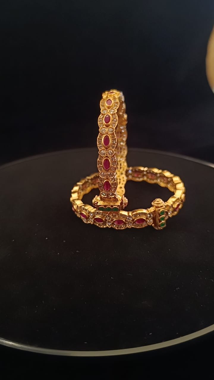 Ruby stones and green stones scrow model with gold polish bangle
