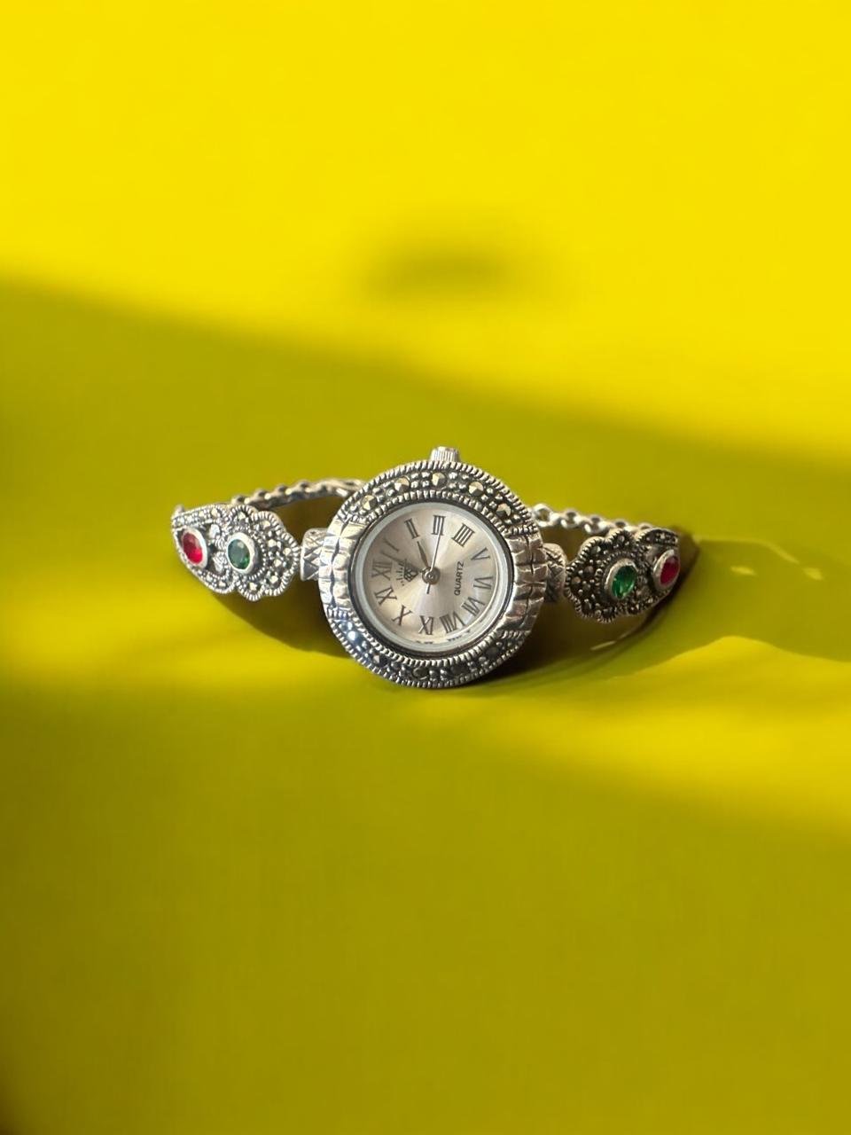 Woman's  watches  marker stones  with  green &red stones